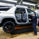 LANSING, MI - FEBRUARY 21: A General Motors worker is shown on the assembly line at the General Motors Lansing Delta Township Assembly Plant on February 21, 2020 in Lansing, Michigan. The plant, which employs over 2,500 workers, is home to the Chevrolet Traverse and Buick Enclave. Today at the plant the three millionth vehicle made at the plant, a Chevrolet Traverse Redline Edition rolled off the line. (Photo by Bill Pugliano/Getty Images)